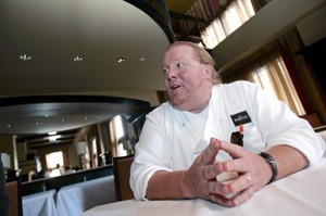 © Reuters. FILE PHOTO: Celebrity chef Batali talks during an interview with Reuters at his latest restaurant, Del Posto, in New York