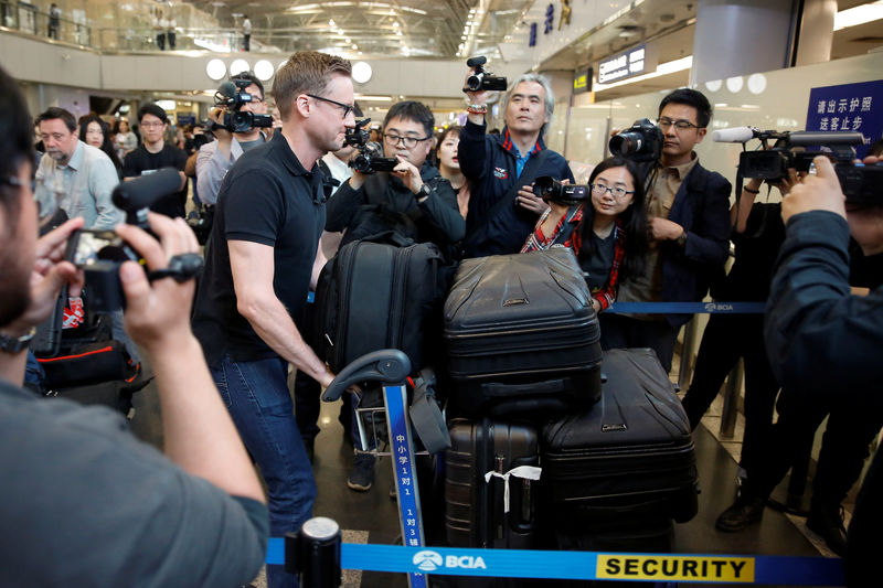 © Reuters. CNN's Will Ripley arrives at Beijing aiport to board a plane to North Korea in Beijing