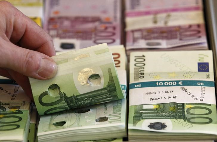 © Reuters. Punctured euro banknotes used for training purposes are presented during news conference on German custom's annual statistics in Berlin