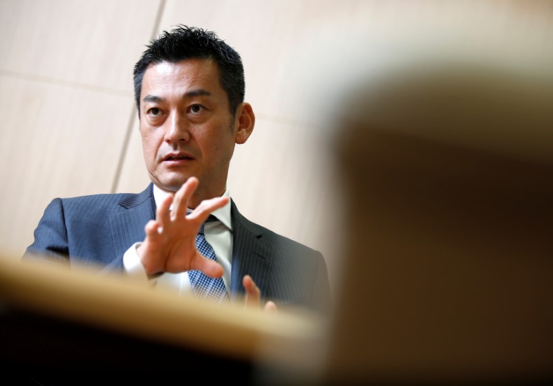 © Reuters. Japan Post Bank Chief Investment Officer Katsunori Sago speaks during an interview for the Reuters Global Investment Outlook Summit in Tokyo