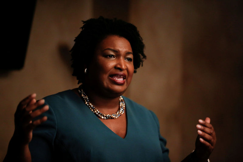 © Reuters. FILE PHOTO: Stacey Abrams speaks at a Young Democrats of Cobb County meeting as she campaigns in Cobb County