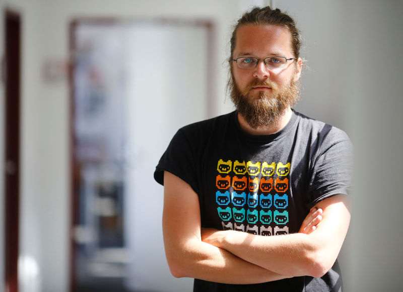 © Reuters. Activist Semsrott of the "OpenSCHFA" campaign is pictured in his office in Berlin