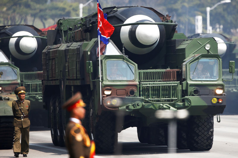 © Reuters. FILE PHOTO: Missiles are driven past the stand with North Korean leader Kim Jong Un and other high ranking officials during a military parade marking the 105th birth anniversary of the country's founding father, Kim Il Sung in Pyongyang
