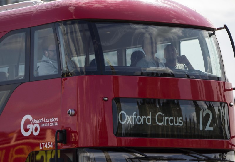 © Reuters. A Go Ahead bus crosses Westminster Bridge in London