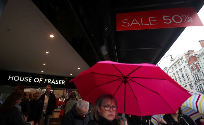 © Reuters. FILE PHOTO: Shoppers walk past House of Fraser on Oxford Street in central London