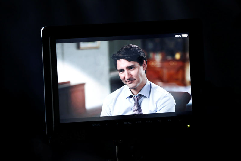© Reuters. Canada's PM Trudeau is pictured on a monitor during an interview with Reuters in La Malbaie