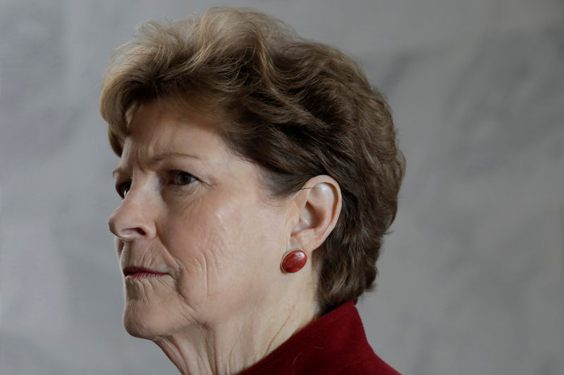 © Reuters. FILE PHOTO: US Senator Jean Shaheen (D-NH) prepares for a conference call at her office on Capitol Hill in Washington