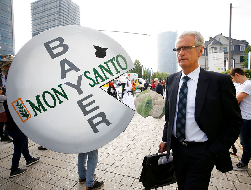 © Reuters. A Bayer's shareholder arrives at the annual general shareholders meeting in Bonn