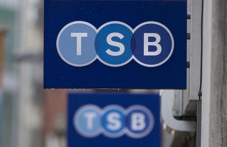 © Reuters. Signs are seen outside of a branch of TSB bank in London