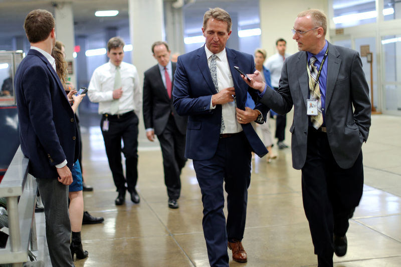 © Reuters. Senators arrive for weekly party caucus luncheons
