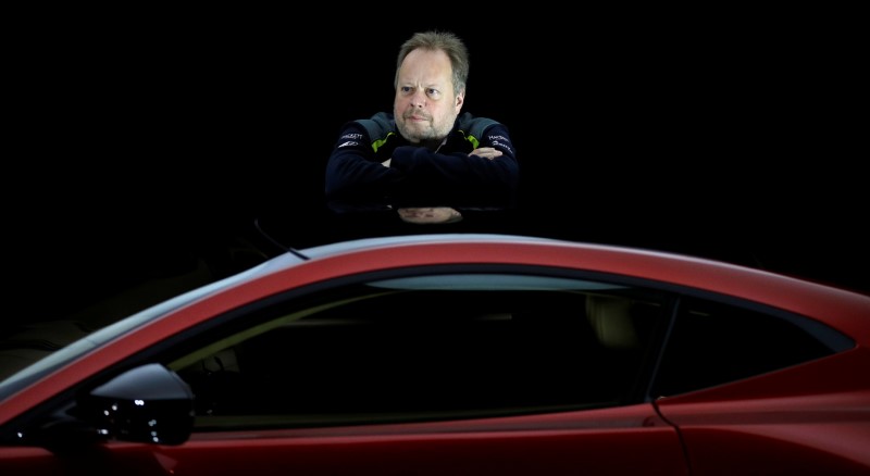 © Reuters. Andy Palmer, CEO of Aston Martin, poses for a photograph next to the company's new Vantage car in Gaydon, Britain