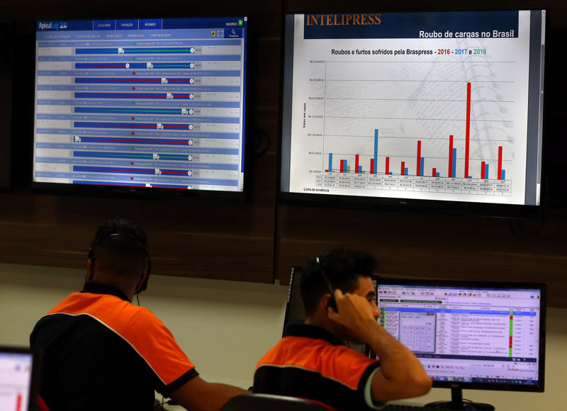 © Reuters. Employees work at trucking and logistics firm Braspress in Guarulhos