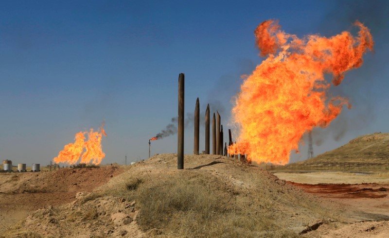 © Reuters. Flames emerge from flare stacks at the oil fields in Kirkuk