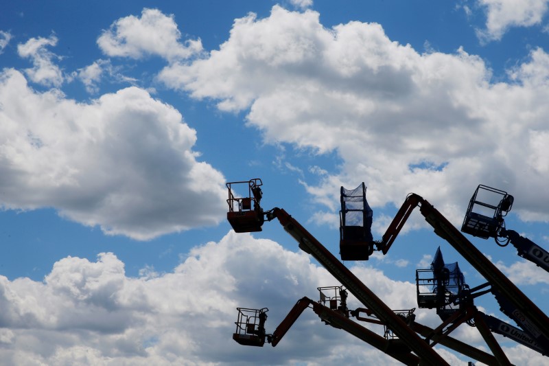 © Reuters. Construction lifts are parked near the Drydock Center in Boston