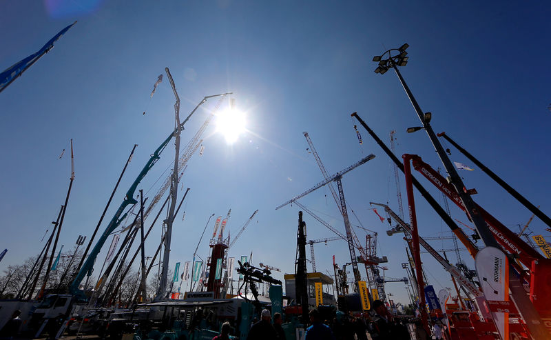 © Reuters. FILE PHOTO: Cranes are on display at the 'Bauma' Trade Fair for Construction, Building Material and Mining Machines and Construction Vehicles and Equipment in Munich