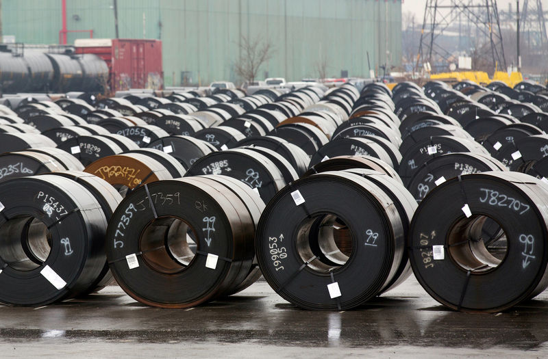 © Reuters. FILE PHOTO: Stored rolls of steel are seen outside the ArcelorMittal Dofasco plant in Hamilton