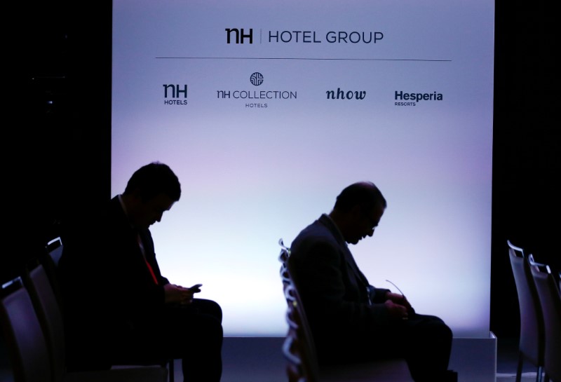 © Reuters. FILE PHOTO: Shareholders of Spain's NH Hotel Group take their seats prior to the start of the AGM in Madrid