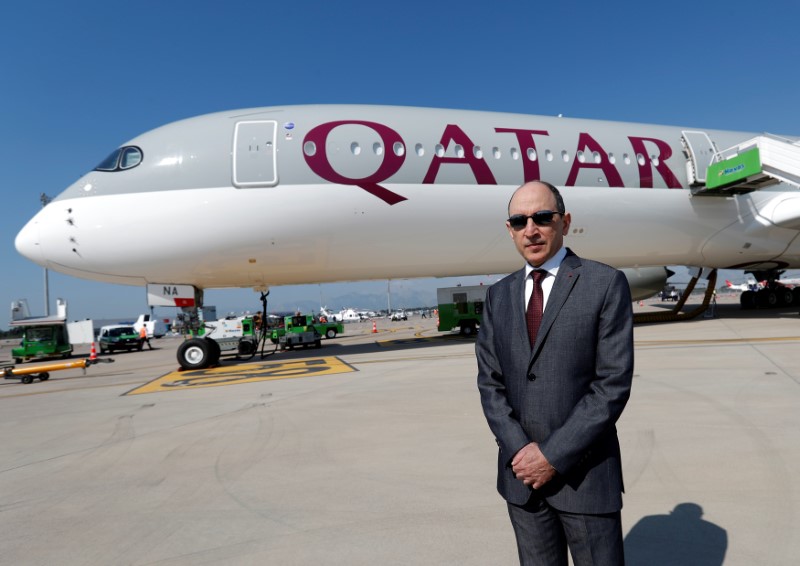 © Reuters. Qatar Airways Chief Executive Officer Akbar al-Baker poses in front of an Airbus A350-1000 at the Eurasia Airshow in the Mediterranean resort city of Antalya