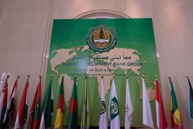© Reuters. A Banner with arabic countries flags are seen at the entrance of the Islamic Development Bank Group in Jeddah