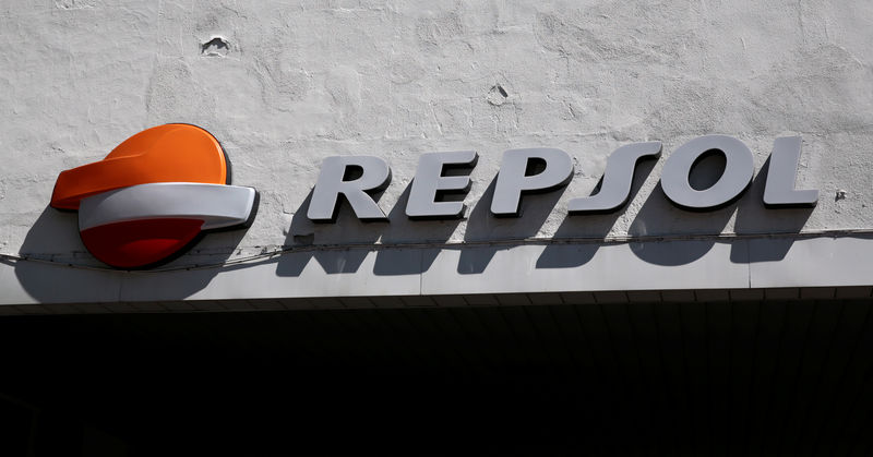 © Reuters. FILE PHOTO: A Repsol logo can be seen on top of a petrol station in Madrid, Spain