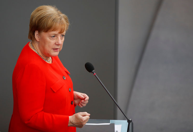 © Reuters. German Chancellor Angela Merkel gestures during a session at the lower house of parliament Bundestag in Berlin