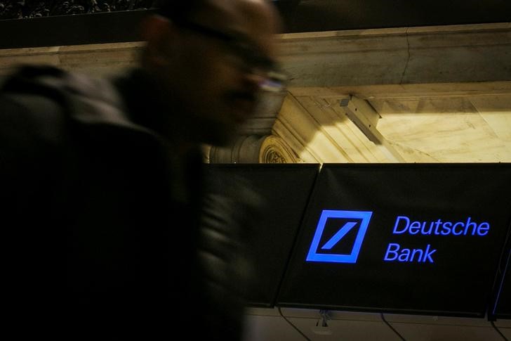 © Reuters. FILE PHOTO:    A Deutsche Bank sign is seen on the floor of the New York Stock Exchange
