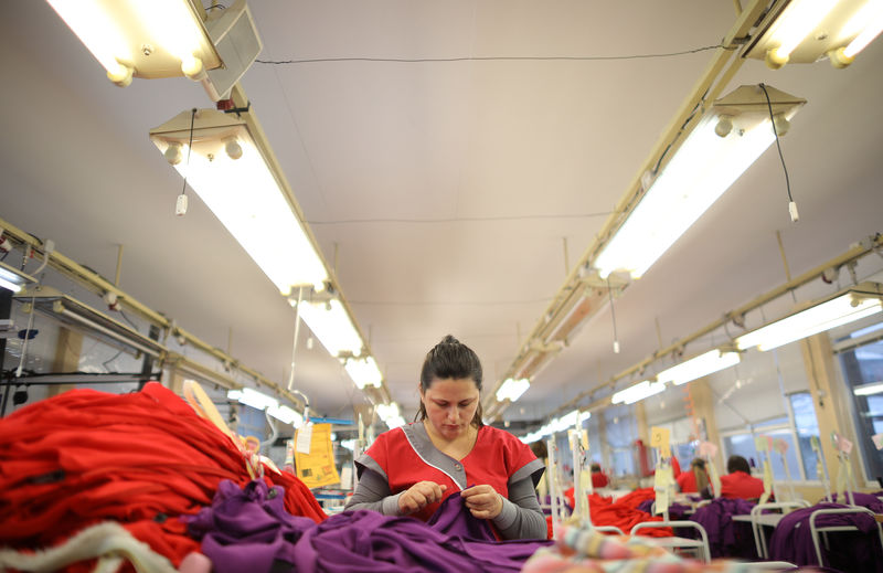 © Reuters. Woman works in "MIK-BG" garment factory in Rousse
