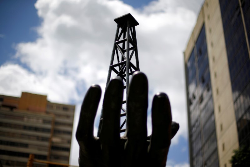 © Reuters. FILE PHOTO: A sculpture is seen outside a building of Venezuela's state oil company PDVSA in Caracas