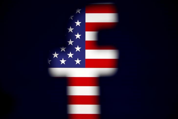 © Reuters. A 3D-printed Facebook logo is displayed in front of a U.S. flag in this illustration