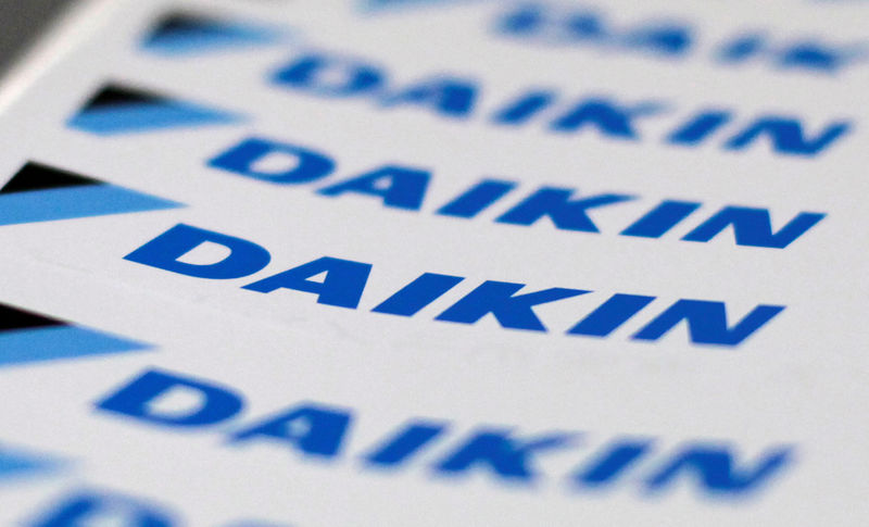 © Reuters. FILE PHOTO: The logos of Daikin Industries Ltd are seen at the company's office in Tokyo