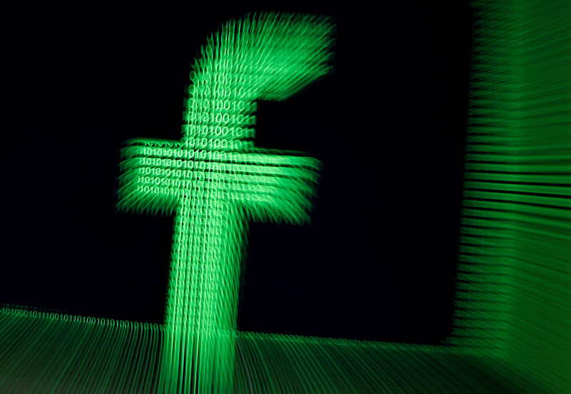 © Reuters. FILE PHOTO: Illustration of the Facebook logo in binary digits