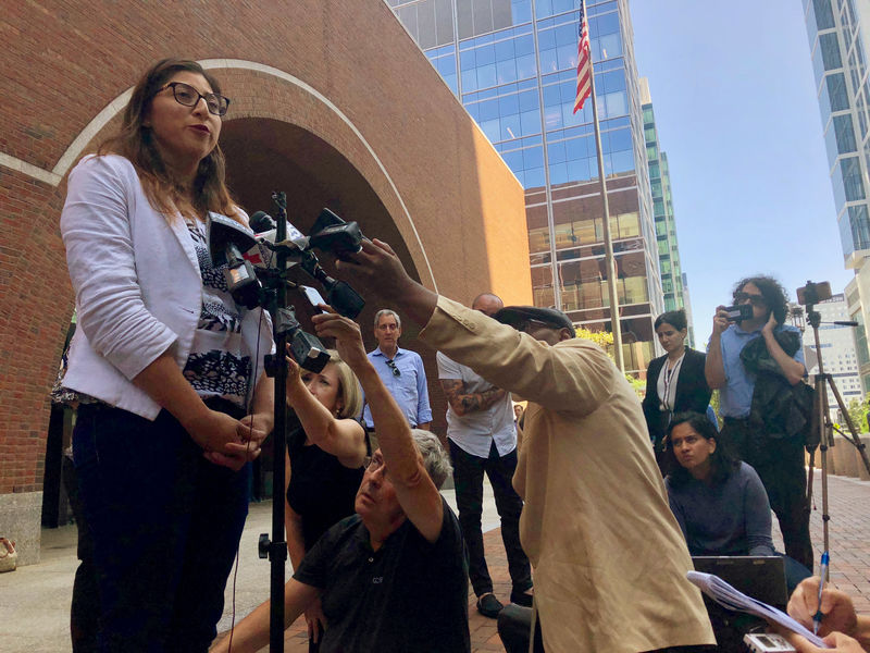 © Reuters. Lilian Calderon a Guatemalan immigrant married to a U.S. citizen speaks to reporters outside of the federal courthouse in Boston