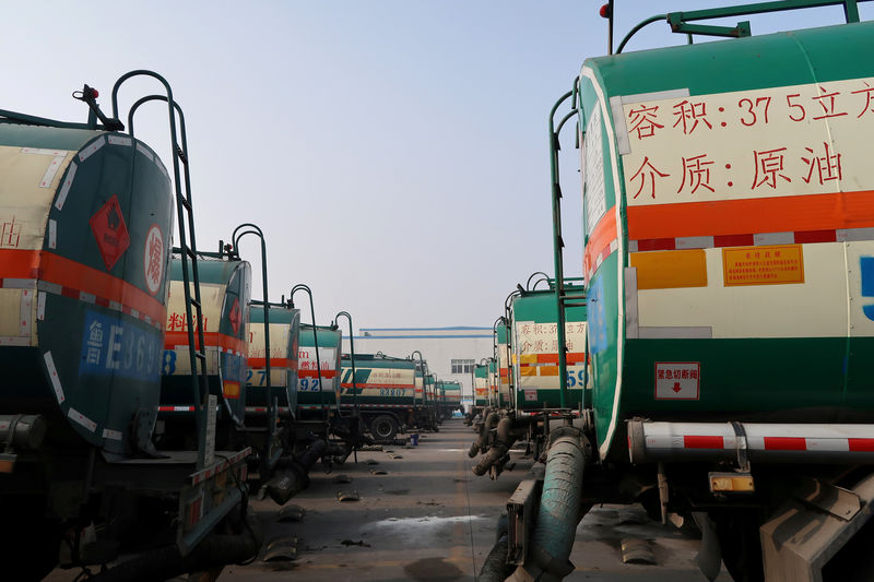 © Reuters. FILE PHOTO: Crude oil tankers are seen at a plant of Shandong Haike Group in Dongying