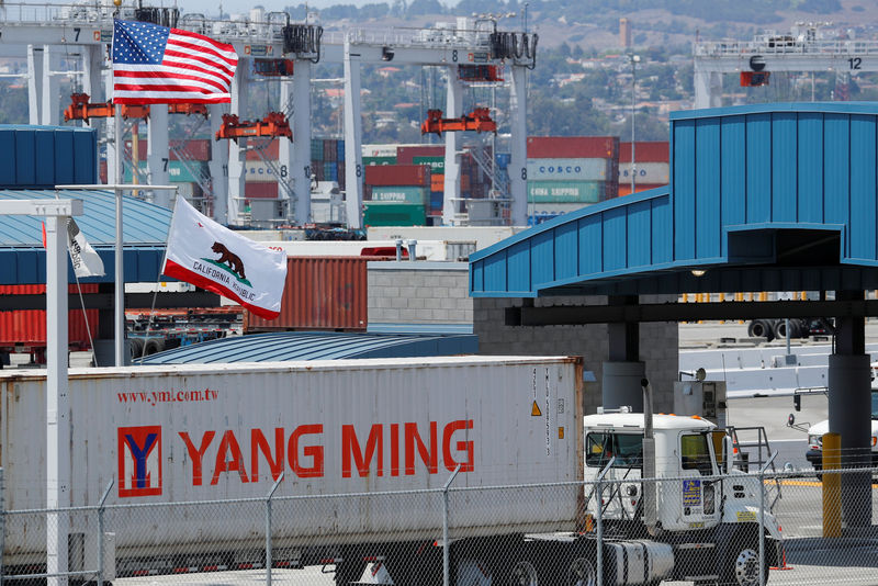 © Reuters. FILE PHOTO: A truck hauls a container at the port of Los Angeles in Los Angeles, California,