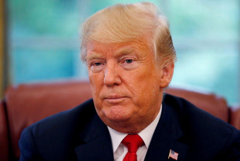 © Reuters. FILE PHOTO: U.S. President Trump listens to question during an interview with Reuters in the Oval Office of the White House in Washington