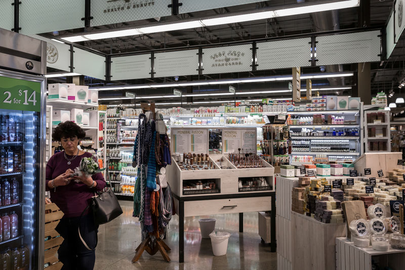 © Reuters. FILE PHOTO - A woman shops in the Health & Beauty section of a Whole Foods in Upper St. Clair