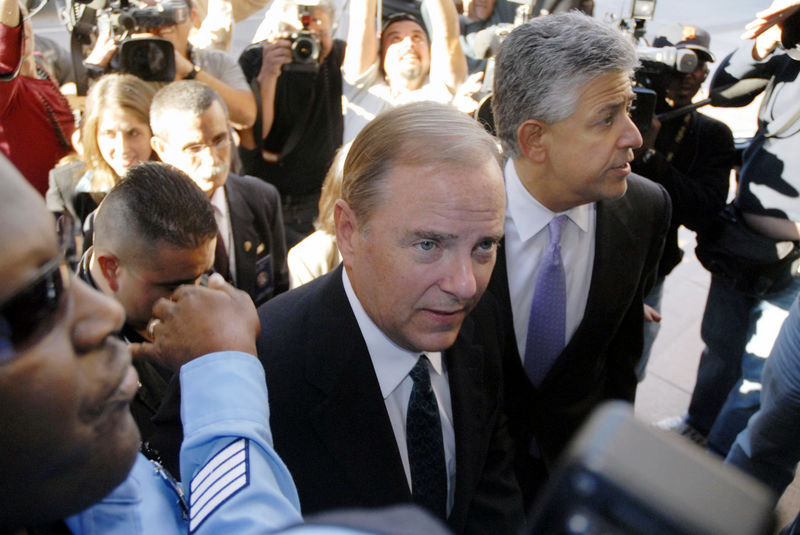 © Reuters. FILE PHOTO: Jeff Skilling, former Enron CEO, is escorted by federal marshals away from Houston Federal court