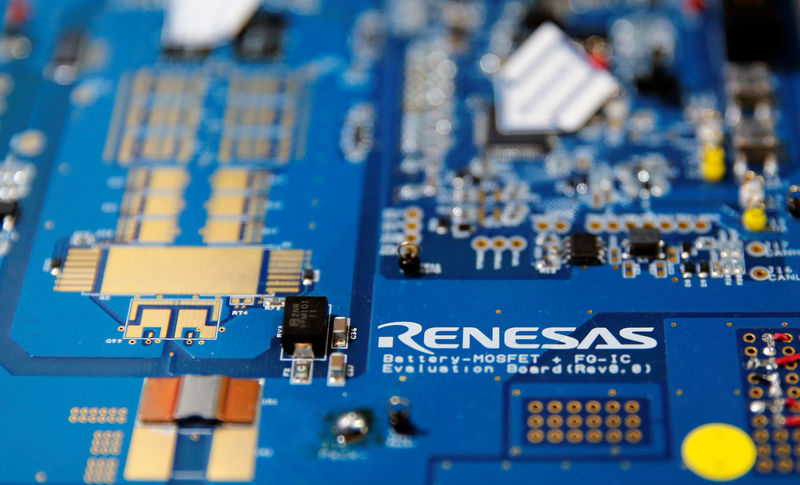 © Reuters. Renesas Electronics Corp's logo is seen on its substrate at the company's conference in Tokyo