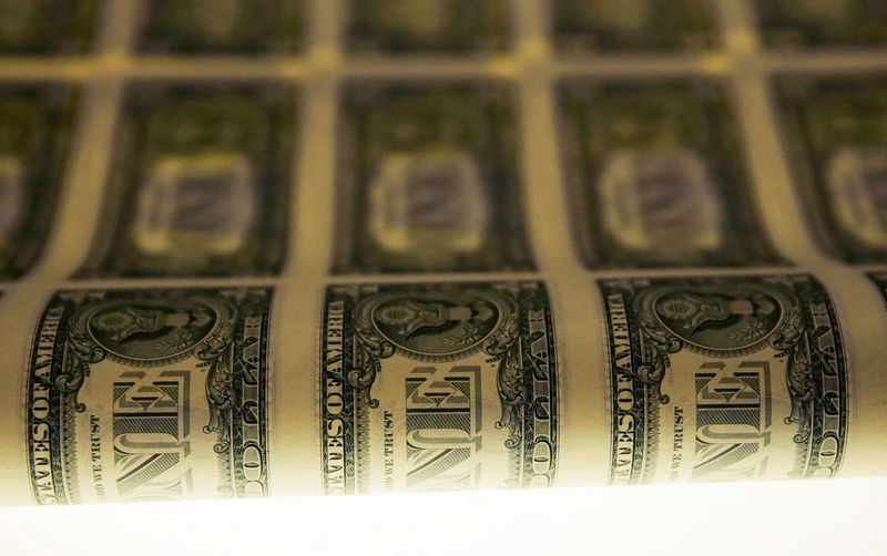 © Reuters. FILE PHOTO: A sheet of United States one dollar bills is seen on a light table during production at the Bureau of Engraving and Printing in Washington