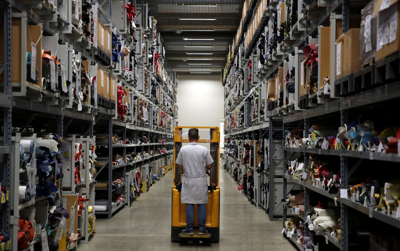 © Reuters. FILE PHOTO: Prada's employee works inside the factory designed by architect Guido Canali in Valvigna