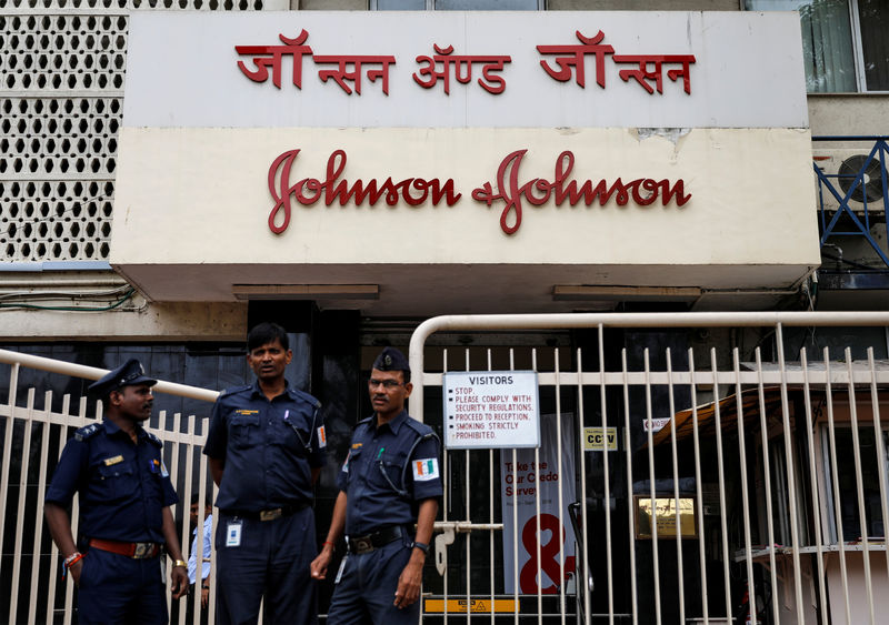 © Reuters. Security guards stand outside the office of Johnson & Johnson in Mumbai