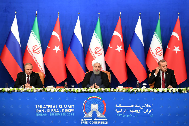 © Reuters. President Putin of Russia, Rouhani of Iran and Erdogan of Turkey attend a news conference following their meeting in Tehran