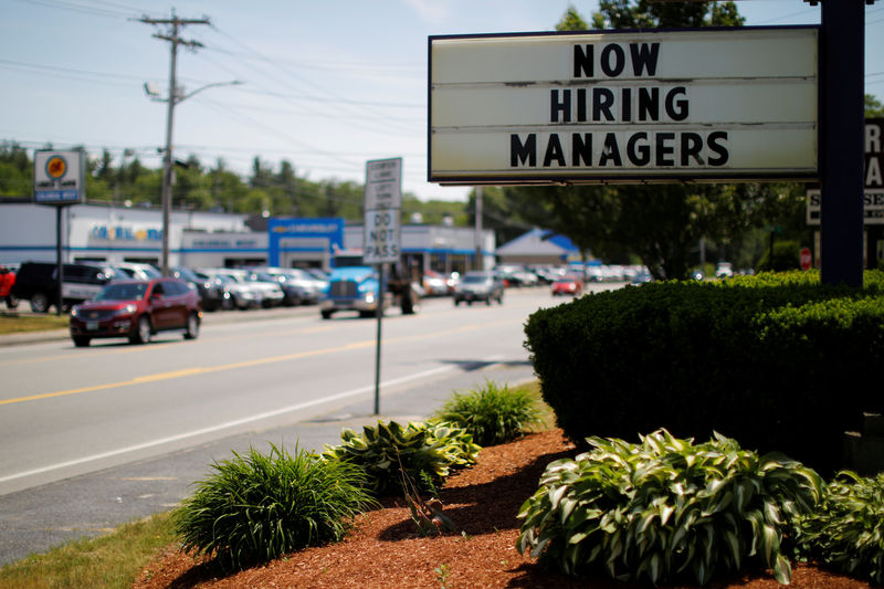 © Reuters. FILE PHOTO: The sign on a Taco Bell restaurant advertises "Now Hiring Managers" in Fitchburg