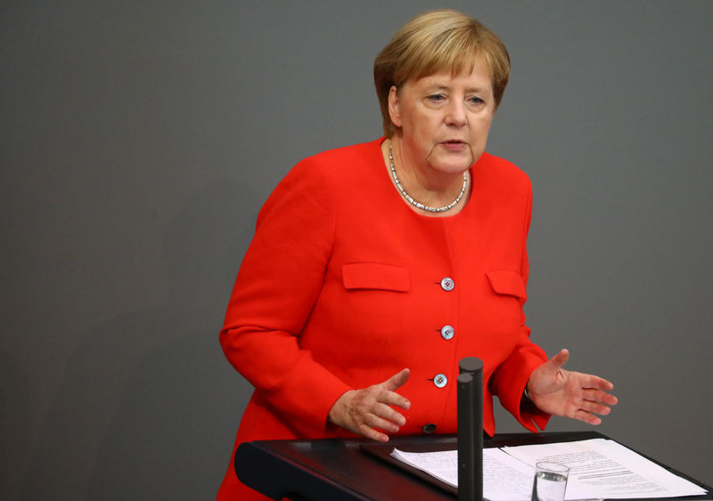 Image result for Merkel condemns far-right xenophobia, Nazi slogans