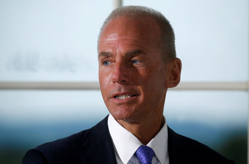 © Reuters. FILE PHOTO: Dennis Muilenburg, president and chief executive officer of The Boeing Company, introduces himself during a dinner with business leaders hosted by U.S. President Donald Trump at Trump National Golf Club in Bedminster