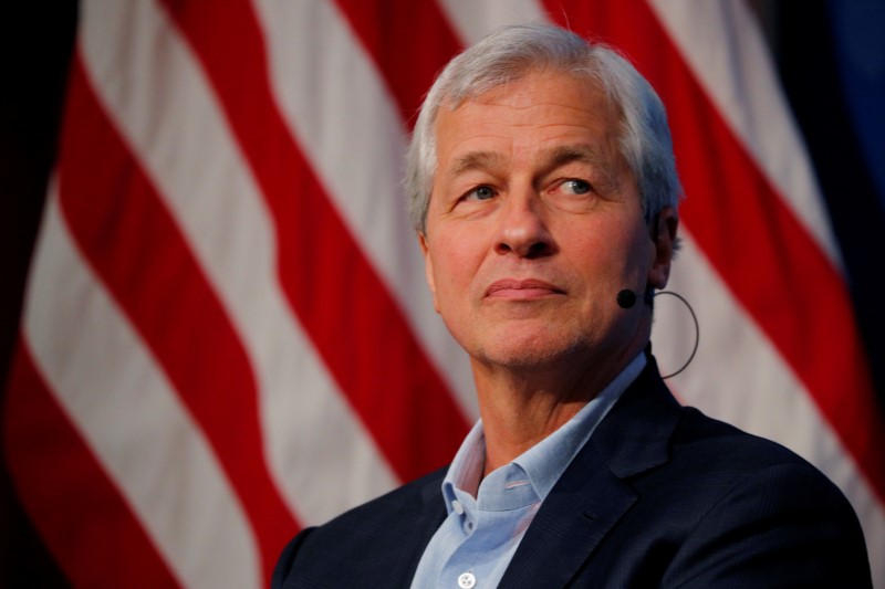 © Reuters. FILE PHOTO: Dimon, CEO of JPMorgan Chase, takes part in a panel discussion about investing in Detroit at the Kennedy School of Government at Harvard University in Cambridge