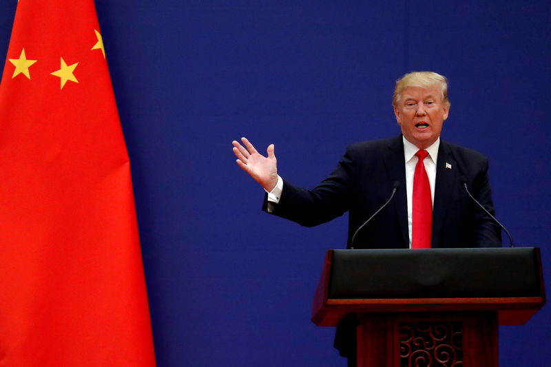 © Reuters. FILE PHOTO: U.S. President Donald Trump delivers his speech as he and China's President Xi Jinping meet business leaders at the Great Hall of the People in Beijing