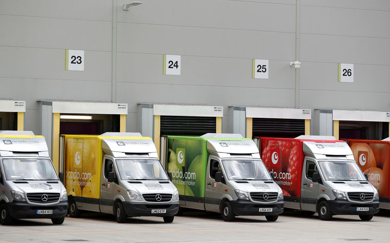 © Reuters. FILE PHOTO: Delivery vans are lined up prior to dispatch at the Ocado CFC (Customer Fulfilment Centre) in Andover