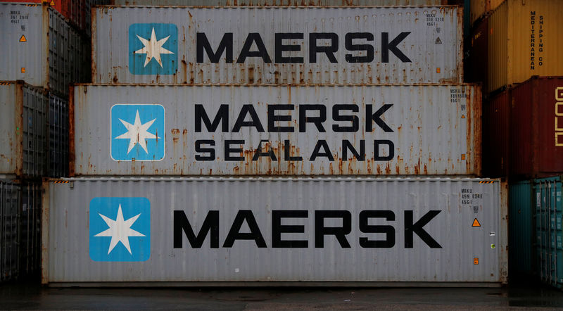 © Reuters. Empty Maersk shipping containers are seen stacked at Peel Ports container terminal in Liverpool