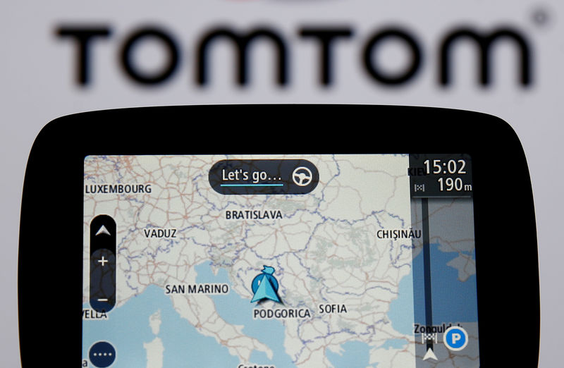 © Reuters. FILE PHOTO: TomTom navigation seen in front of TomTom displayed logo